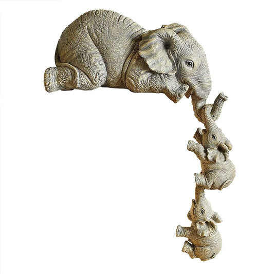 Mama Elephant holding her hanging Babies
